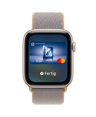 Apple Watch SE 3, aluminum case, starlight color, screen shows Wallet, payment card graphic, right side exterior, Digital Crown dial, Sport Loop band, chambray blue color (light blue-gray)