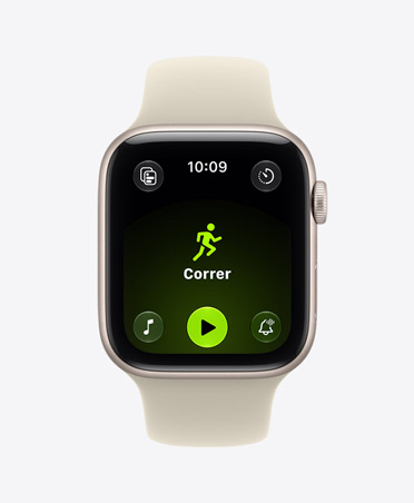 Apple Watch SE 3, aluminum case, starlight color, screen shows Workout app (outdoor run), right side exterior, Digital Crown dial, Sport Band, sand color (light tan)