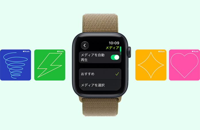 ミッドナイトアルミニウムケースのApple Watch SE 3。画面にメディアプレーヤーが表示されている。右側面の外観、Digital Crownのダイヤル。オリーブ（茶色がかったグリーン）のスポーツループバンド。背景にはApple Musicのグラフィックカードが映し出され、渦巻き、稲妻、ダイヤモンド、ハートのイラストが表示されている