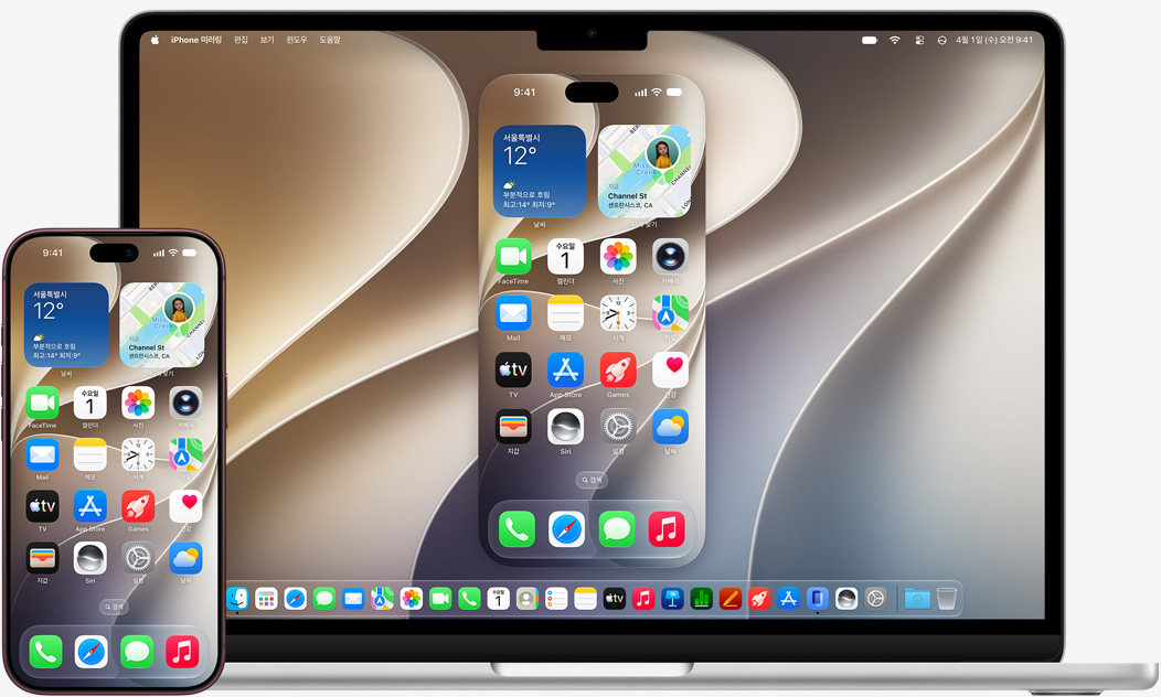 iPhone과 MacBook을 나란히 놓고 MacBook에 표시된 미러링 효과를 보여주는 모습. 디스플레이 상단에 캘린더 및 메모 위젯이 표시되어 있고, 하단에 다양한 앱이 표시되어 있습니다.