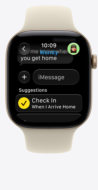 Apple Watch Series 12, screen shows Check In suggestion in iMessage, aluminium case, light gold colour, connected to Sport Band, sand colour (pale tan)