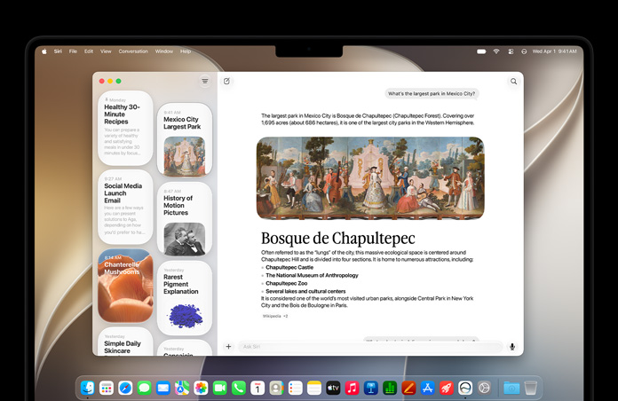 14‑calowy MacBook Pro w kolorze gwiezdnej czerni. Na ekranie widać aplikację Siri wyświetlającą aktywną rozmowę z Siri AI i poprzednie konwersacje na pasku bocznym.