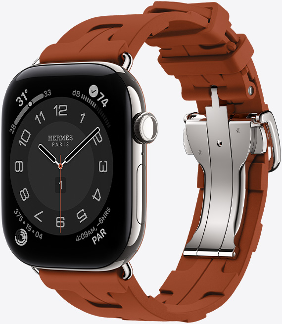 Apple Watch Hermès Series 12, Circulaire analogue watch face, (hour, minute and second hands, complications: Weather, Noise, Activity rings and Paris time), titanium case, silver colour, right side exterior, Digital Crown, side button, paired with Kilim Single Tour strap, cuivre colour (brown), moulded rubber material, geometric interlocking design, silver-coloured metal clasp