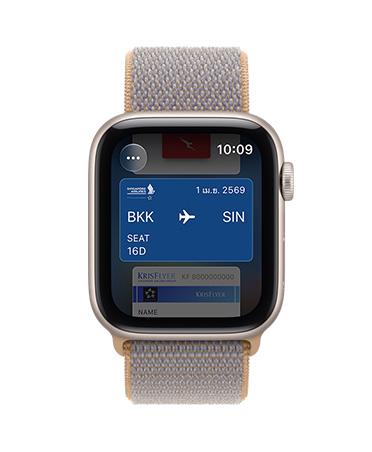 Apple Watch SE 3, aluminum case, starlight color, screen shows Wallet, payment card graphic, right side exterior, Digital Crown dial, Sport Loop band, chambray blue color (light blue-gray)