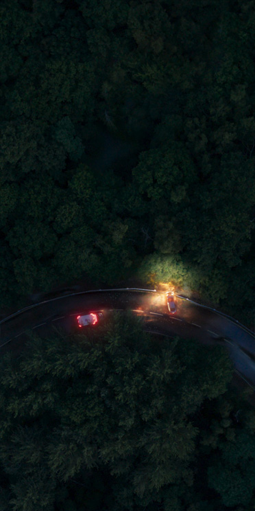Overhead zoomed-out photo of Earth from space with satellite icon