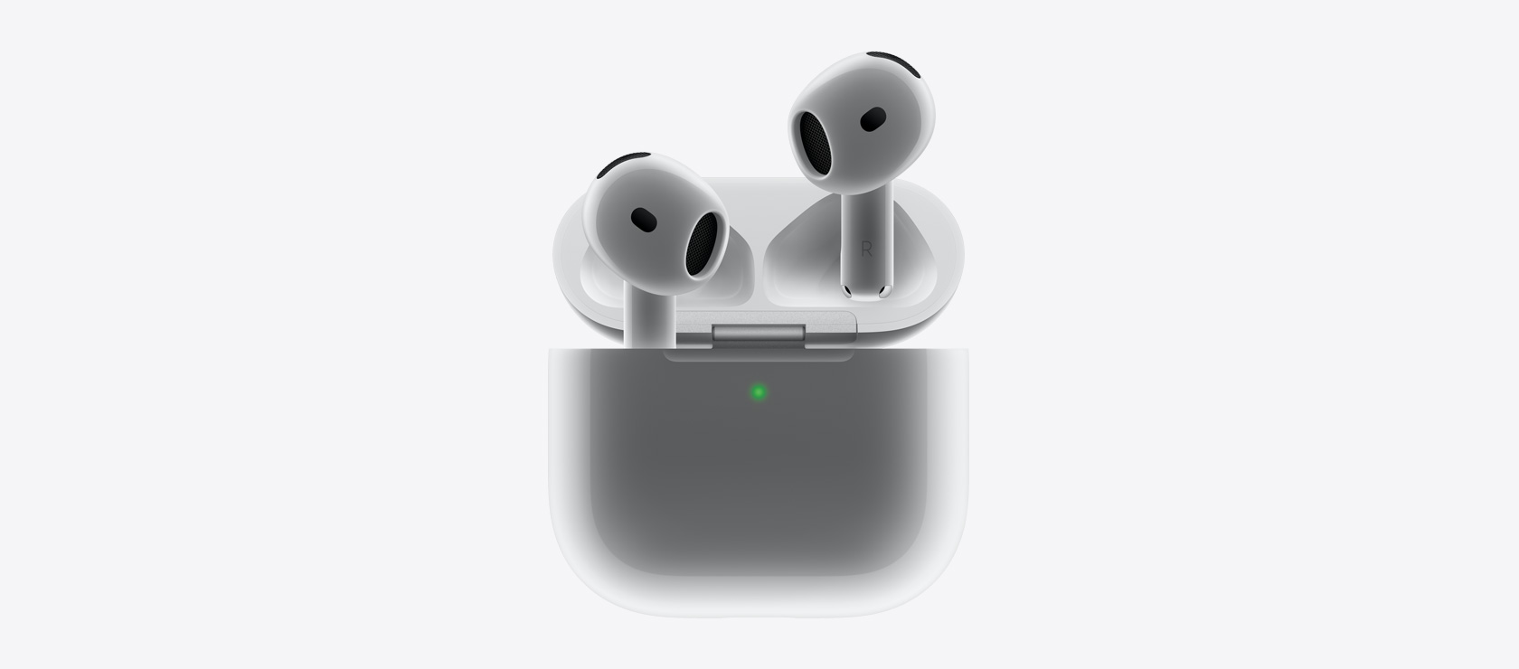 Slušalice AirPods 4 kako pristaju u kutijicu za punjenje.
