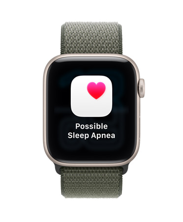 Apple Watch SE 3, κάσα από αλουμίνιο, χρώμα αστροφεγγιά, γνωστοποίηση πιθανής υπνικής άπνοιας, ροζ καρδιά σε λευκό πλαίσιο, εξωτερική δεξιά πλαϊνή όψη, Digital Crown, λουράκι Sport Loop, χρώμα πράσινο του δάσους
