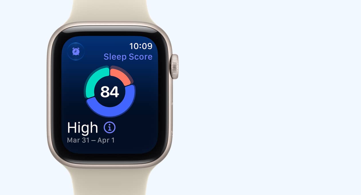 Apple Watch SE 3, aluminum case, starlight color, screen shows sleep score circle graph, right side exterior, Digital Crown dial, Sport Band, sand color (pale tan)