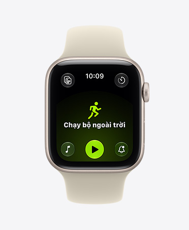Apple Watch SE 3, vỏ nhôm, màu ánh sao, bài tập Chạy Bộ Ngoài Trời đang mở, các nút điều khiển Apple Music ở cuối màn hình, Dây Đeo Thể Thao, màu vàng dạ quang.